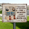 Personalized Couple With Pets Metal Sign - Gift Idea For Mother's Day/Father's Day/Pet Lovers - Up to 5 Pets - Welcome To Our Home The Humans Just Live Here With Us